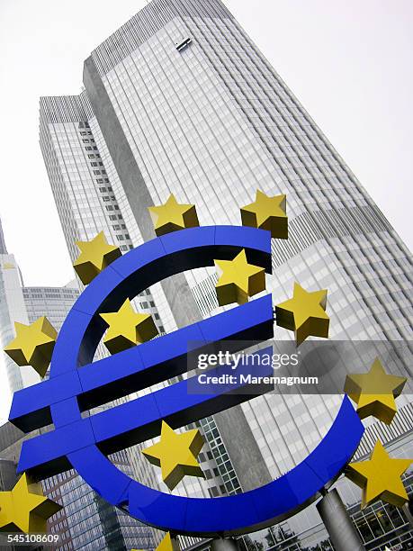 euro symbol and the eurotower skyscraper - banca centrale europea foto e immagini stock