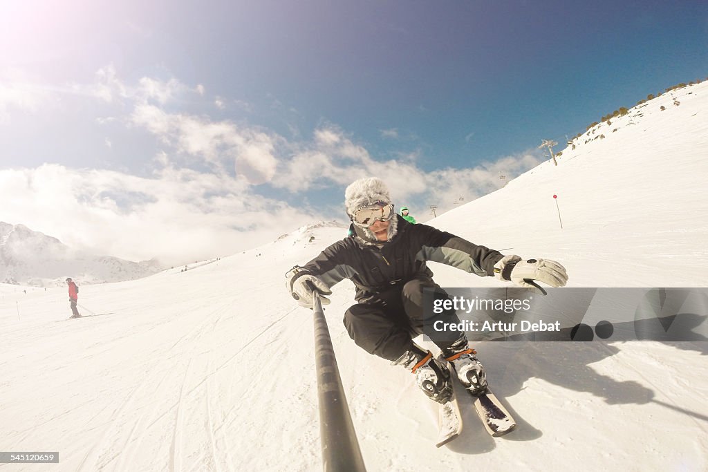 Skier on Pyrenees taking selfie with selfie stick