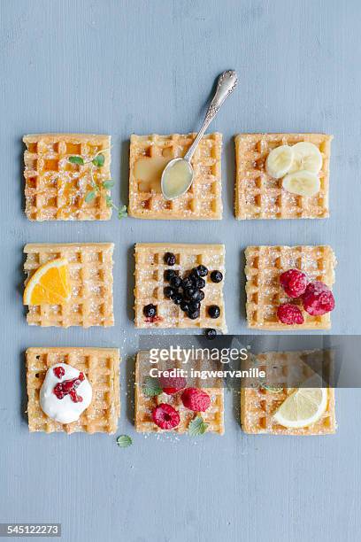 waffles with different toppings - waffle stock-fotos und bilder