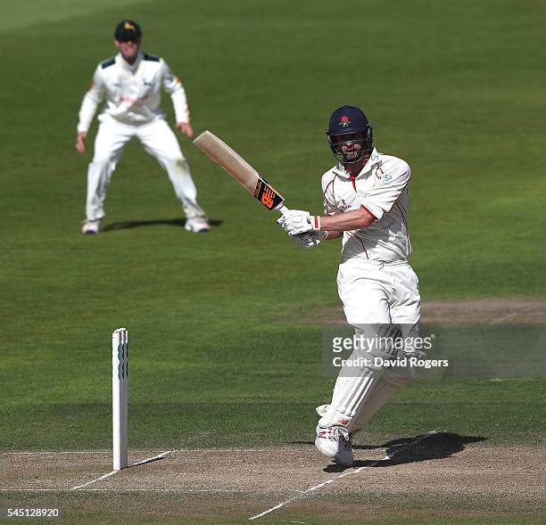 Tom Smith of Lancashire pulls the ball during the Specsavers County Championship division one match between Nottinghamshire and Lancashire at Trent...