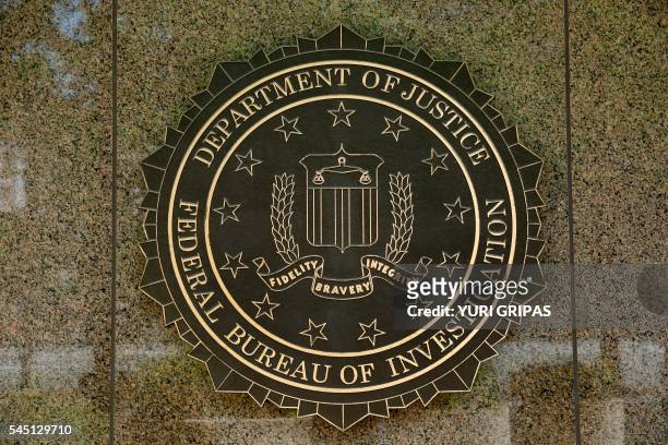 The FBI seal is seen outside the headquarters building in Washington, DC on July 5, 2016. - The FBI said Tuesday it will not recommend charges over...