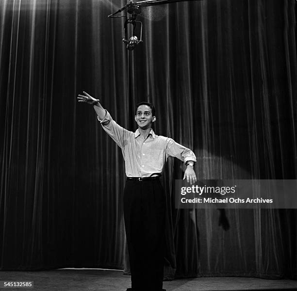 Joel Gray performs on the "Toast of the Town" show hosted by Ed Sullivan at the Maxine Elliott Theater in New York, New York.