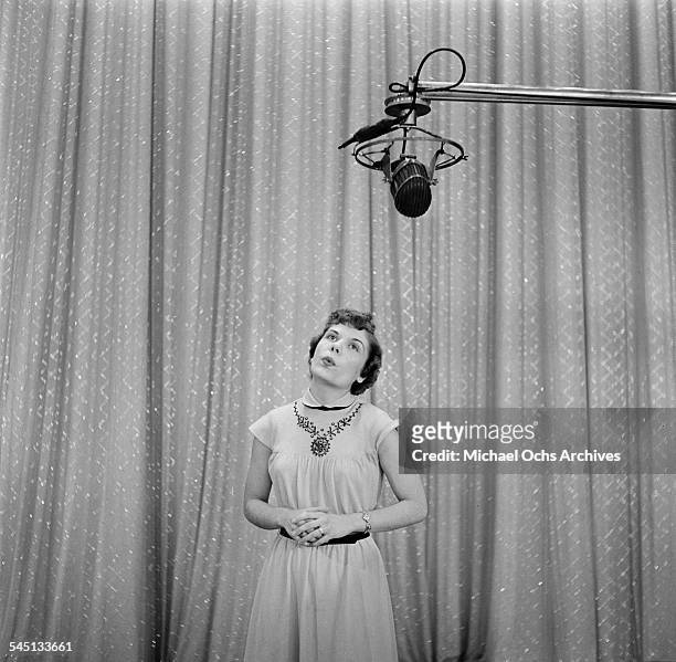 Whistler Pauline Di Mauro performs on the "Toast of the Town" show hosted by Ed Sullivan at the Maxine Elliott Theater in New York, New York.