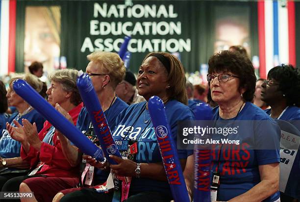 Delegates wait for Democratic presidential candidate Hillary Rodham Clinton to address the 95th Representative Assembly of the National Education...