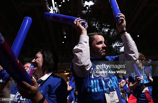 Delegates make noise with thundersticks as they wait for Democratic presidential candidate Hillary Rodham Clinton to address the 95th Representative...
