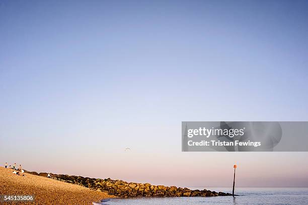 The shingle beach and sea defences at Hythe, Romney Marsh on September 29th, 2011 in New Romney, England. This image is from a series exploring the...