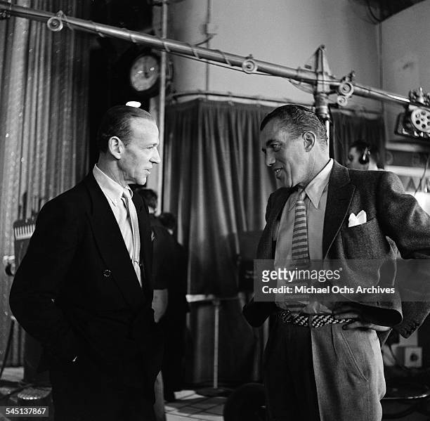 Ed Sullivan and Fred Astaire talk during rehearsals for the "Toast of the Town" show hosted by Ed Sullivan at the Maxine Elliott Theater in New York,...