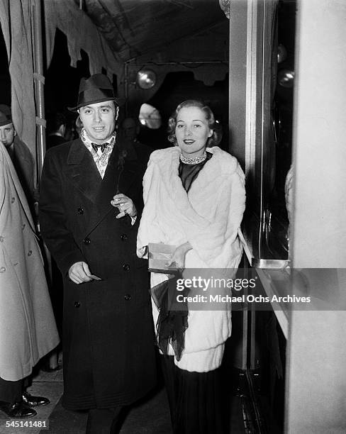 French actor Charles Boyer and wife Pat Paterson arrive at an event in Los Angeles, California.