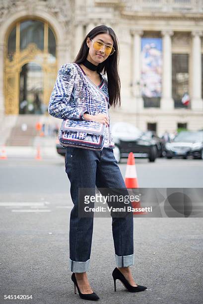 Justine Lee poses wearing Chanel after the Chanel show at the Grand Palais during Paris Fashion Week Haute Couture FW 16/17 on July 5, 2016 in Paris,...
