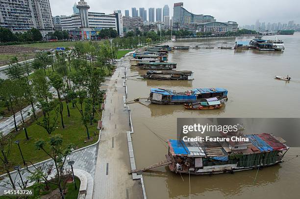 The flooded Hanjiang River is seen raising the boats to the level of the riverside park on July 04, 2016 in Hubei province, China. Heavy rains have...