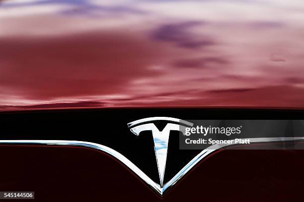 Tesla model S sits parked outside of a new Tesla showroom and service center in Red Hook, Brooklyn on July 5, 2016 in New York City. The electric car...