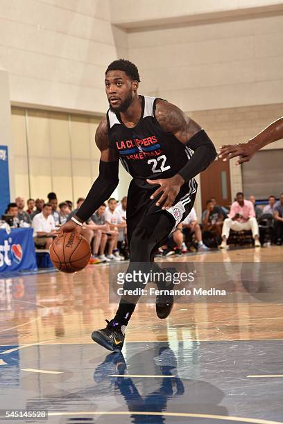 Branden Dawson of Los Angeles Clippers handles the ball against the New York Knicks during the 2016 Summer League at the Amway Center on July 5, 2016...