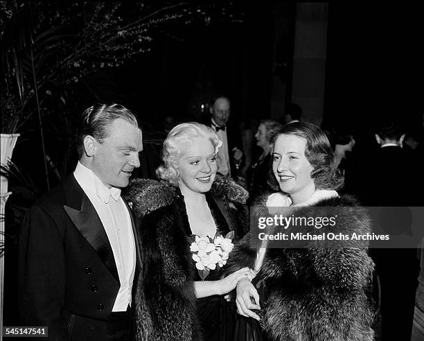 Actor James Cagney with actress Alice Faye and Barbara Stanwyck attend an event in Los Angeles, California.