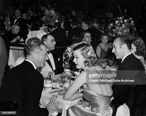Actress Joan Bennett, husband producer Walter Wanger and actor Charles Boyer attend an event in Los Angeles, California.