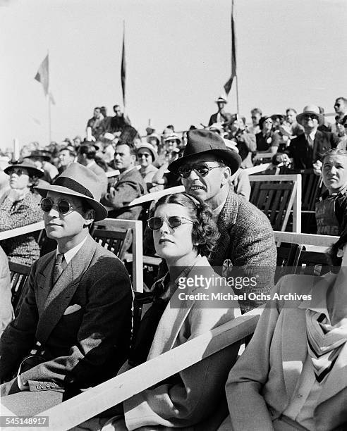 Actor Gary Cooper and wife Veronica Balfe and Franchot Tone attend an event in Los Angeles, California.