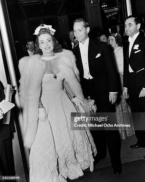 Actress Joan Crawford and husband Franchot Tone arrive at an event in Los Angeles, California.