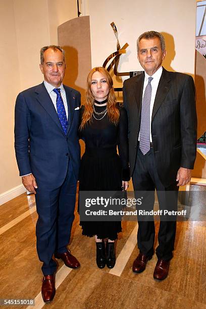 Actress Josephine de la Baume standing between Ferruccio Ferragamo and Leonardo Ferragamo attend the Re Opening of Salvatore Ferragamo Boutique at...