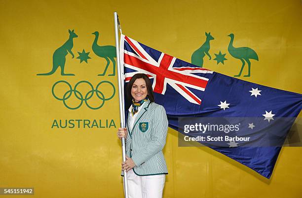 Anna Meares poses with the Australian flag during the Australian Olympic Games flag bearer announcement at Federation Square on July 6, 2016 in...