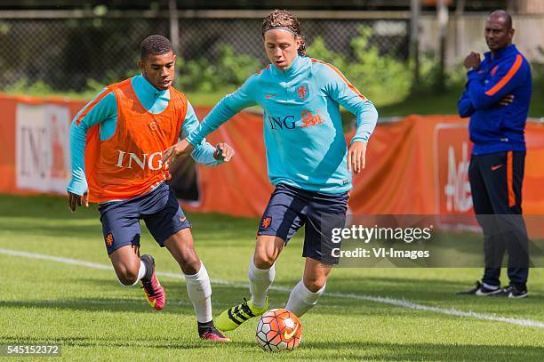 Juninho Bacuna of The Netherlands U19, Giovanni Troupe of The Netherlands U19, coach Aron Winter of The Netherlands U19 during a training session of...