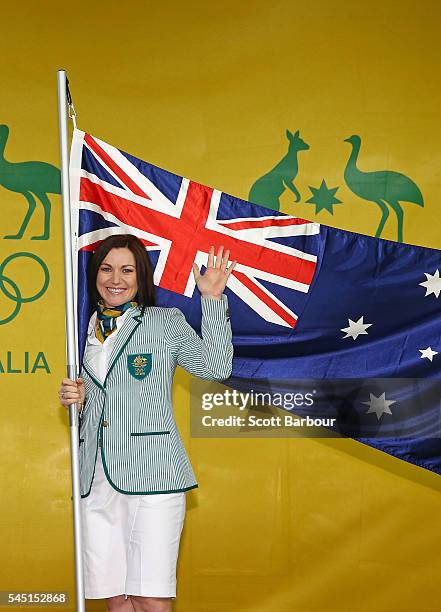 Anna Meares poses with the Australian flag during the Australian Olympic Games flag bearer announcement at Federation Square on July 6, 2016 in...