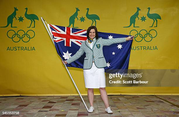 Anna Meares poses with the Australian flag during the Australian Olympic Games flag bearer announcement at Federation Square on July 6, 2016 in...