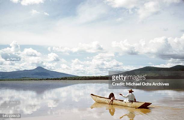 Fisherman paddles a boat on the lake in Patzcuaro, Michoacan, Mexico.