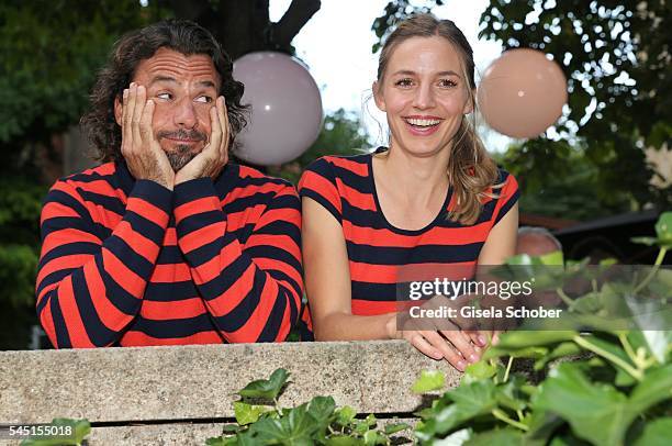 Annika Blendl and Stephan Luca wearing the same pullover of Iris von Arnim during the Iris von Arnim by Unuetzer launch party of the cashmere sneaker...