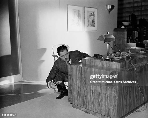 Actor Warner Baxter in action on set of a movie in Los Angeles, California.