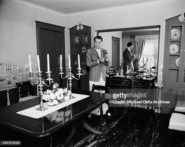 Actor Ralph Bellamy poses in his home in Los Angeles, California.