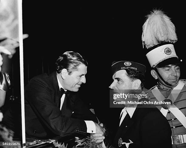 Actor Warner Baxter greets a fan in Los Angeles, California.