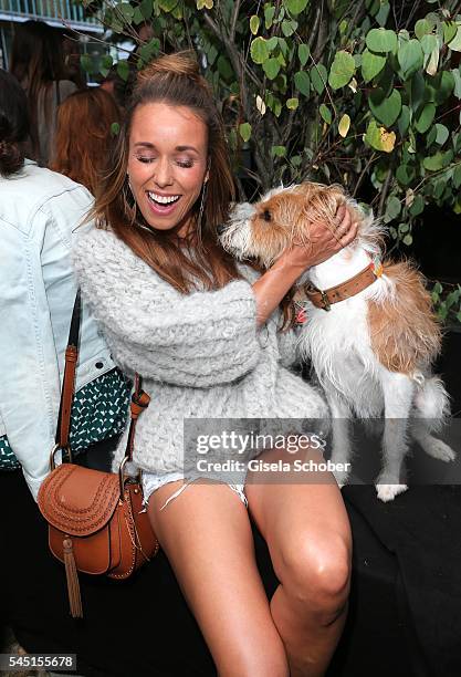 Annemarie Carpendale and her dog Seppi during the Iris von Arnim by Unuetzer launch party of the cashmere sneaker at Bob Beaman Club on July 5, 2016...