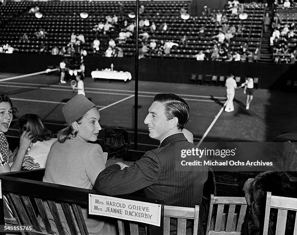 Actor Ray Bolger and his wife Gwendolyn attend the LA Tennis Open in Los Angeles, California.