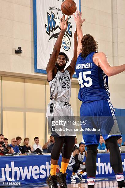 Rakeem Christmas of the Indiana Pacers shoots against Jordan Bachynski of the Detroit Pistons during the Orlando Summer League on July 5, 2016 at...