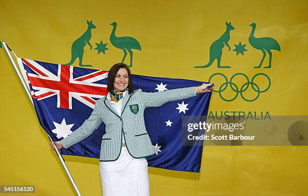 Anna Meares poses with the Australian flag during the Australian Olympic Games flag bearer announcement at Federation Square on July 6, 2016 in...