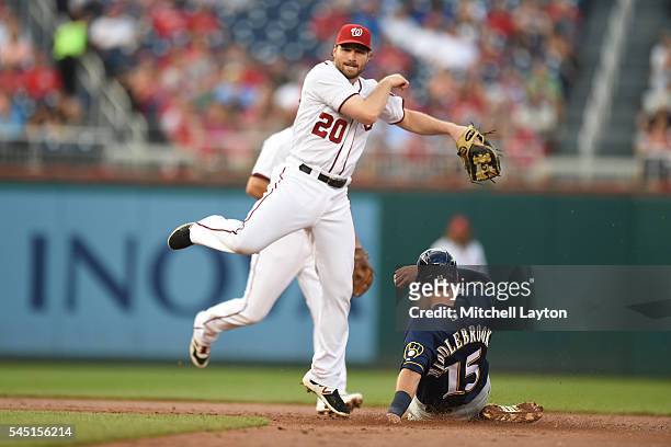 Daniel Murphy of the Washington Nationals forces out Will Middlebrooks of the Milwaukee Brewers on a double lay ball hit by Ramon Flores in the...