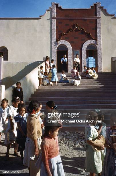 Street view of young children walking in Taxco de Alarcon, Guerrero, Mexico.