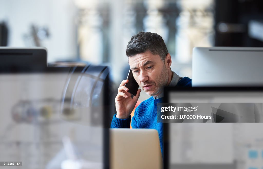 Businessman on the phone in a modern office