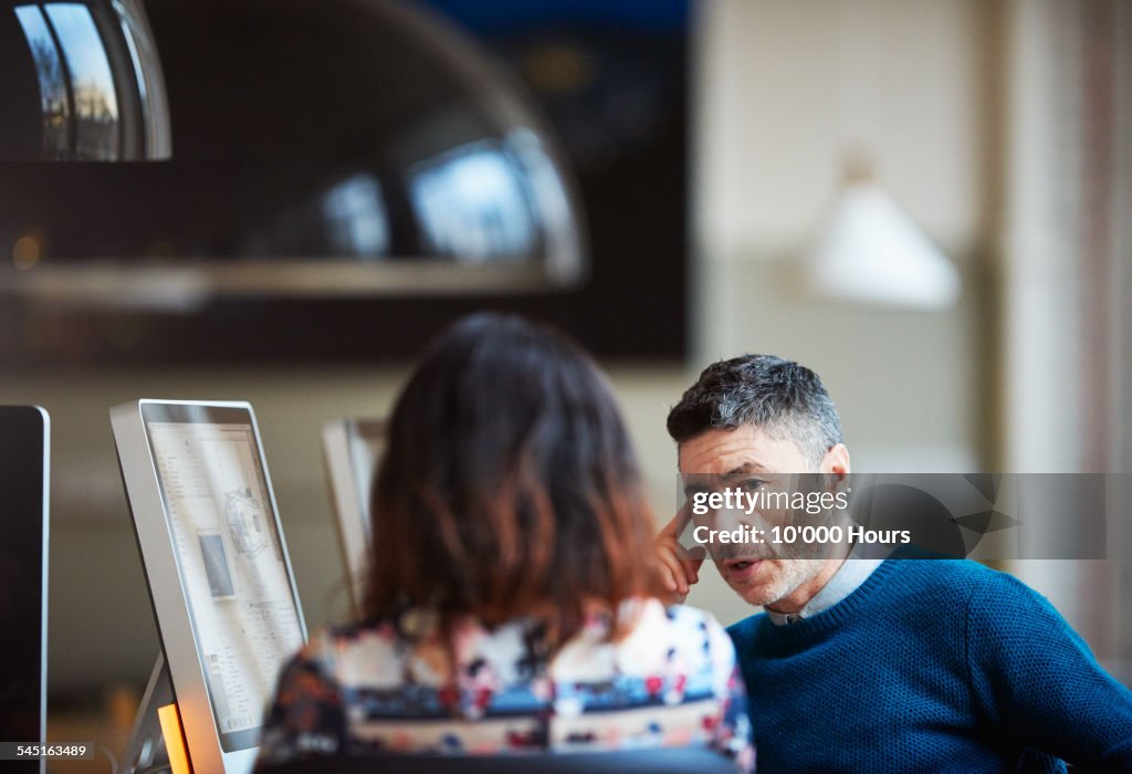 Two business colleagues discussing a project