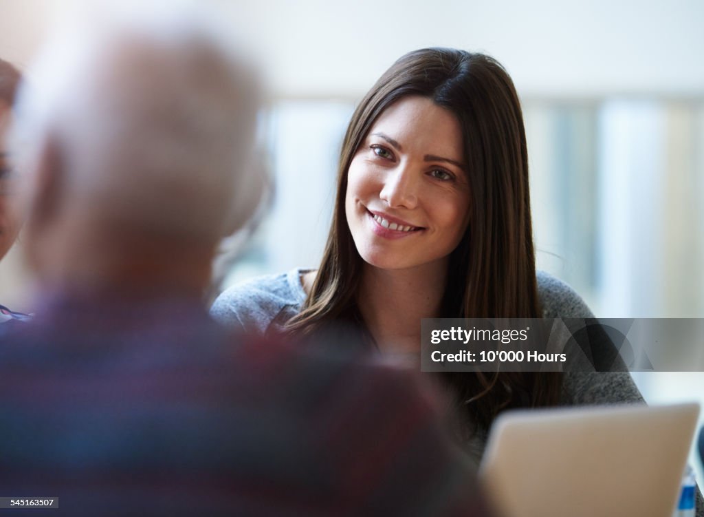 Smiling businesswomen discussing a project