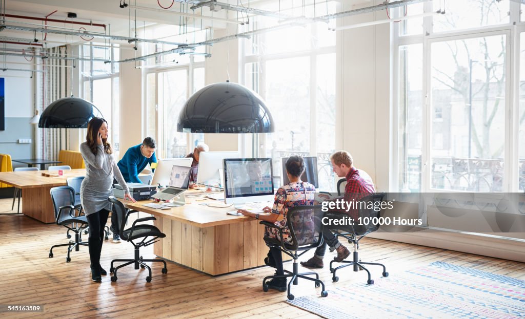 Co-workers working in start up office