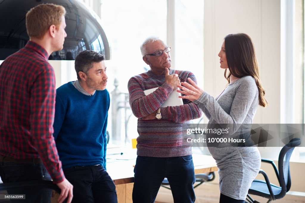 Colleagues in informal meeting in a modern office