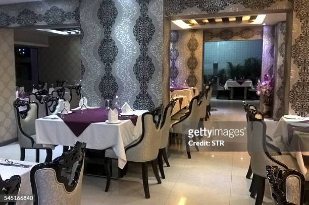 To go with story 'Bangladesh-unrest-religion' In this photograph taken on July 4 famous Indian restaurant Khana Khazana, which is usually filled with...