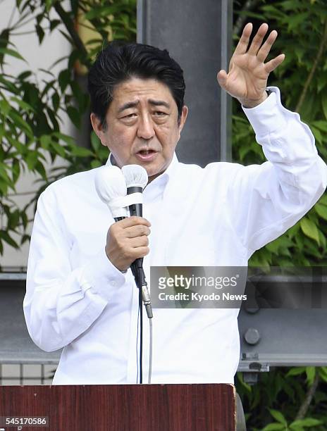 Japanese Prime Minister Shinzo Abe makes a stump speech in the southwestern Japanese city of Hita, Oita Prefecture, on July 4 for the July 10 House...