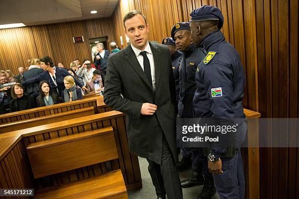 Paralympian athlete Oscar Pistorius, accused of the murder of his girlfriend Reeva Steenkamp three years ago, arrives for a hearing in his murder...