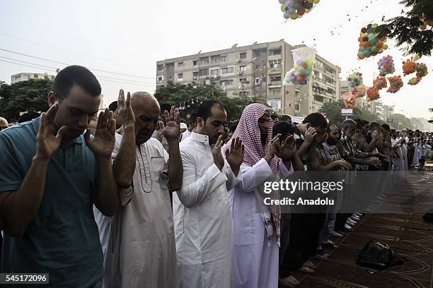 Muslims perform Eid al-Fitr prayer during the Eid al-Fitr holiday at Abu Bakr al-Siddiq Mosque, in Cairo, Egypt on July 06, 2016. Eid al-Fitr is a...