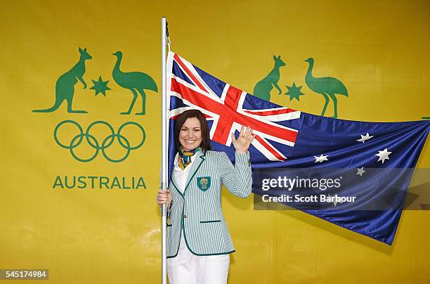 Anna Meares poses with the Australian flag during the Australian Olympic Games flag bearer announcement at Federation Square on July 6, 2016 in...