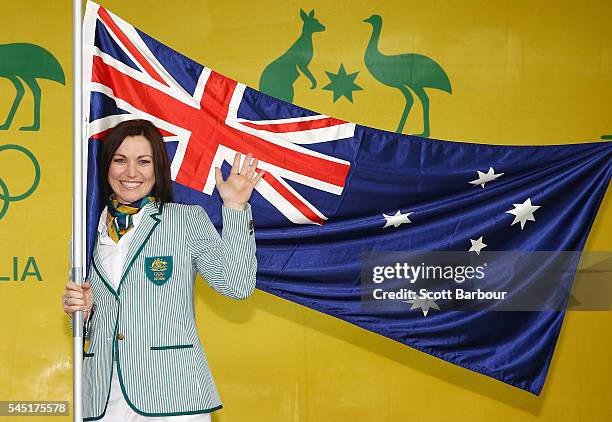 Anna Meares poses with the Australian flag during the Australian Olympic Games flag bearer announcement at Federation Square on July 6, 2016 in...