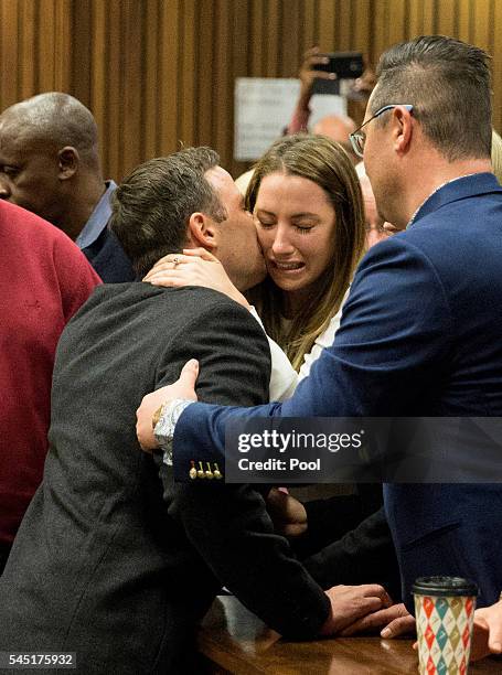 Olympic athlete Oscar Pistorius embraces his sister Aimee Pistorius after sentencing at the High Court on July 6, 2016 at the High Court in Pretoria,...