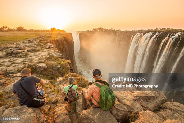 sunset at victoria falls - victoria falls stock pictures, royalty-free photos & images