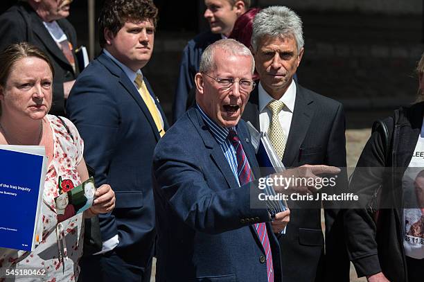 Sarah O'Connor, holds a picture of her brother Sergeant Bob O'Connor who was killed in Iraq in 2005, next to Roger Bacon, father of soldier killed in...